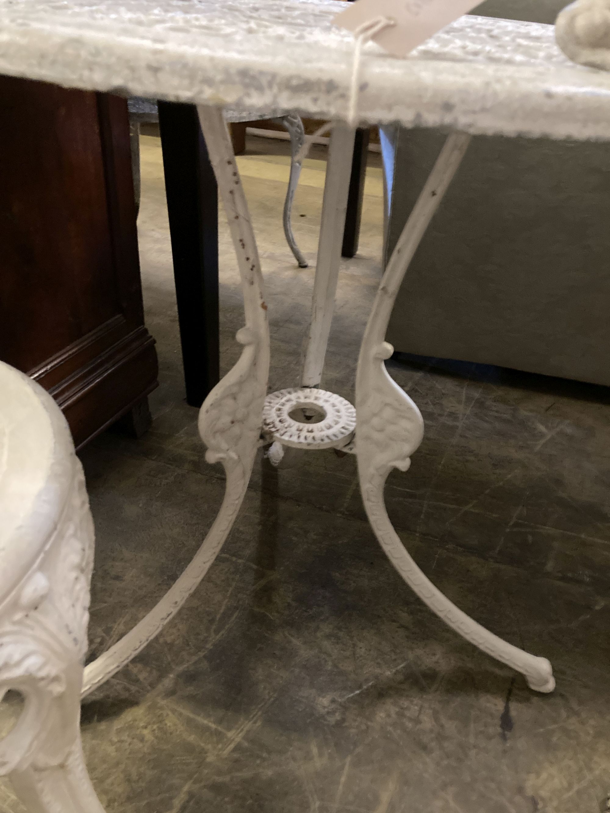 A Victorian style painted aluminium circular garden table, 69cm diameter together with a set of four similar chairs